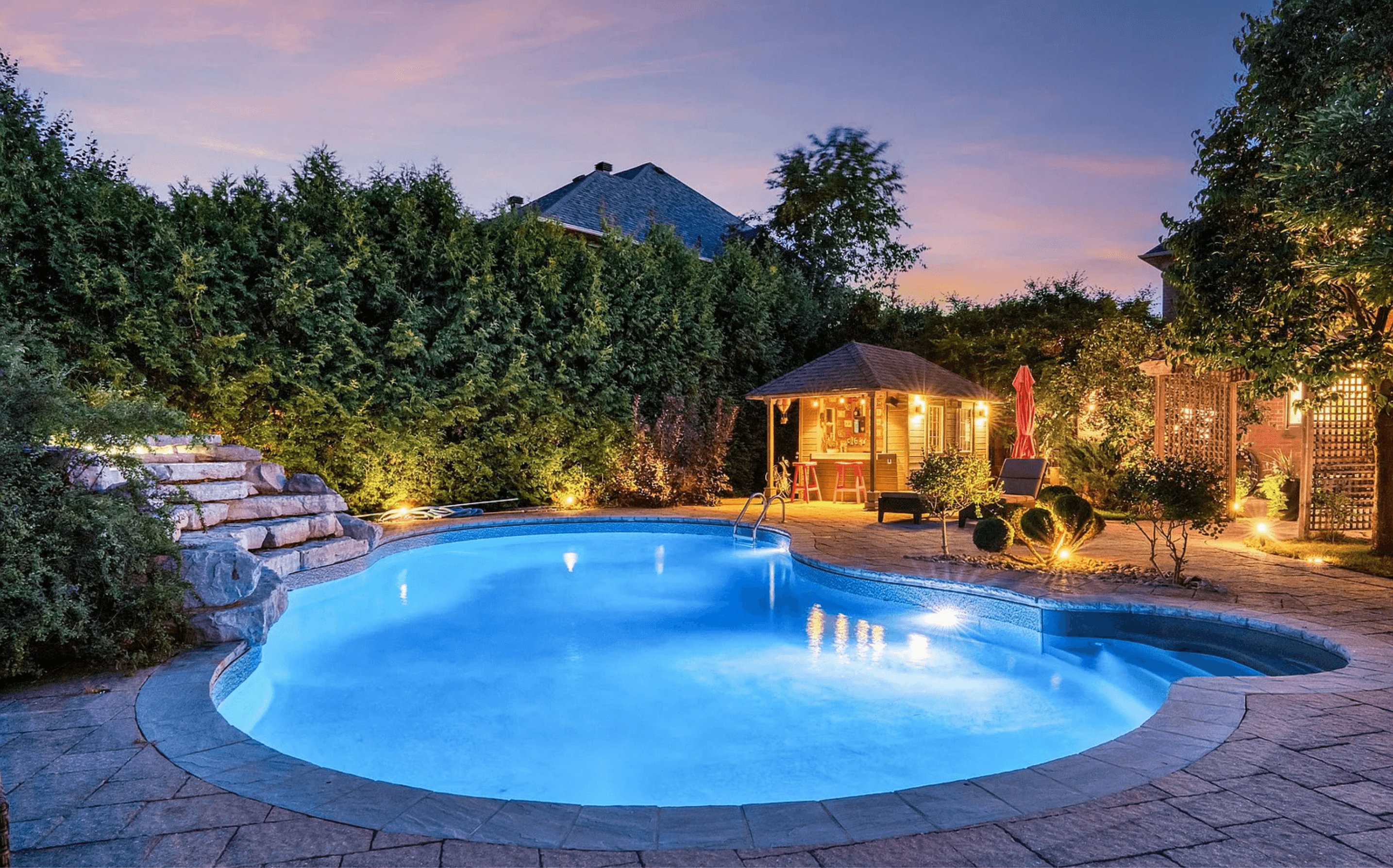 Pool and backyard at dusk
